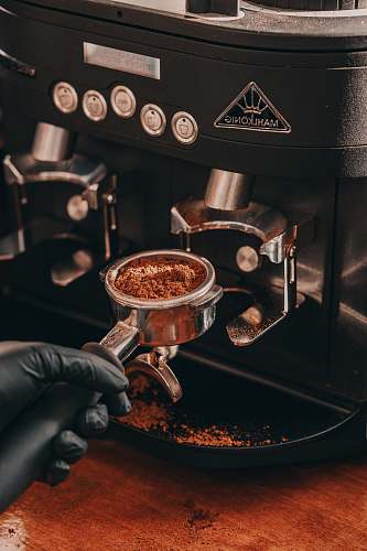 cup person holding coffee grinder espresso